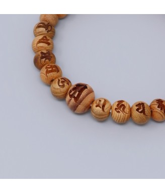 Bracelet en bois Yakusugi sculpté d’un mantra bouddhiste